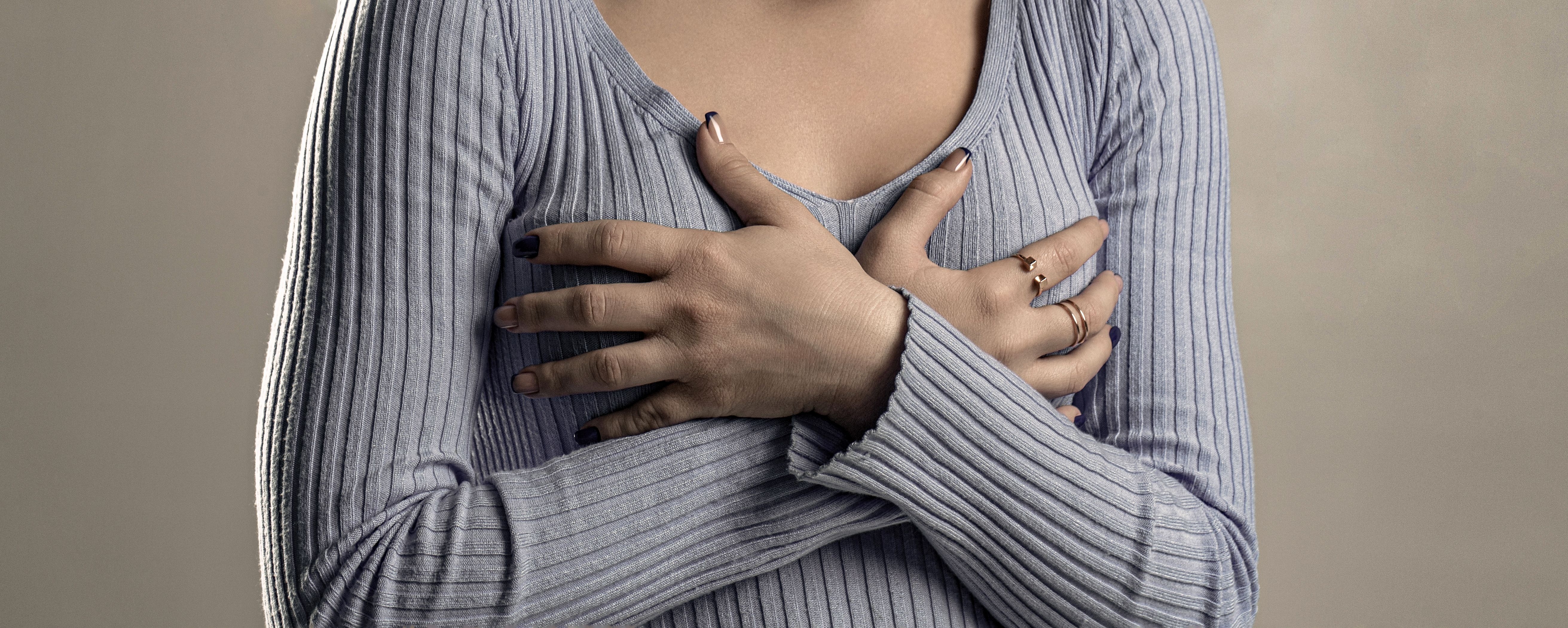 girl-feeling-heart-pain-holding-her-chest-girl-holding-hand-chest-pain-woman-suffering-from-chest-pain-woman-having-heart-a.jpg