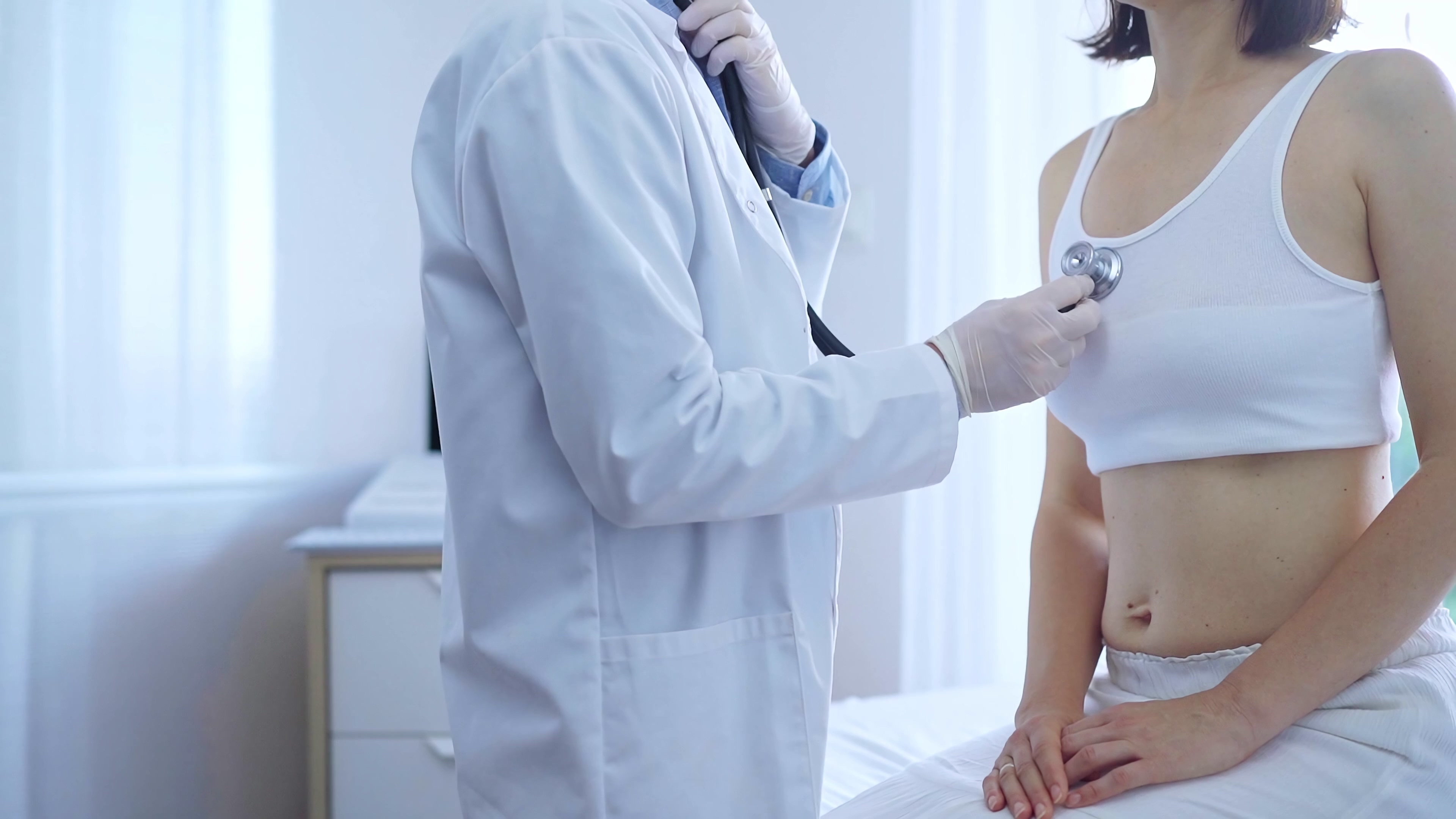 doctor-patient-physician-wearing-white-medical-gloves-is-using-stethoscope-examining-woman-lungs-clinic-medicine-concept.jpg